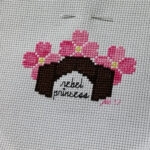 Rebel Princess is a tiny cross stitch design by CatLadyXStitching. It features Princess Leia's iconic cinnamon bun hair and pink flowers.
