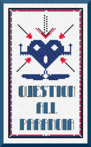 If you're feeling oppressed and are looking for good ways to destress yourself, you could do worse than choosing counted cross stitch as a hobby. This Karma Charms design depicts an anthropomorhpic navy blue heart with an alarmed expression and posture. The words "Question All Paranoia" are just below it. From Grimalkin Crossing.