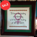 Personal resilience: a Photo of a tastefully framed finish of History Lesson. Legend says "To know the history of embroidery is to know the history of women." There's a symbol of Venus in the background. This design is on sale through 3/31/23 at Grimalkin Crossing.