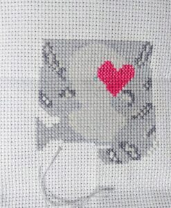 Stitching in progress. Angel cat in misty grays. 