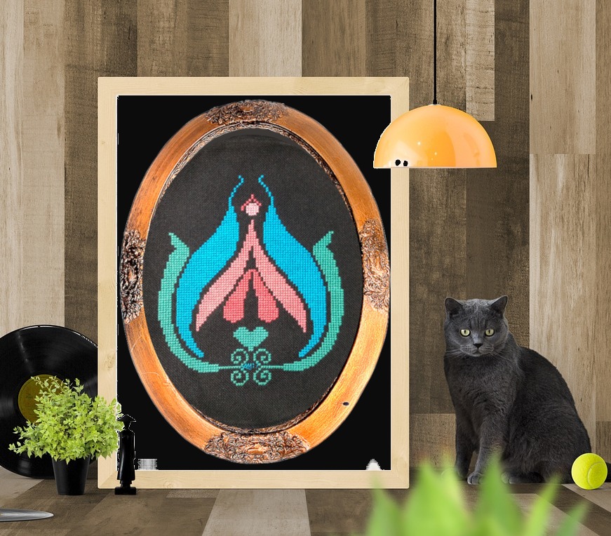When you are bored, stitch a clit! This is a mockup photo for Clitarita, our best-selling design. It's shown in a bronzy-gold oval frame, which in turn is shown in a white pine frame. With a grimalkin beside it, of course! From Grimalkin Crossing.